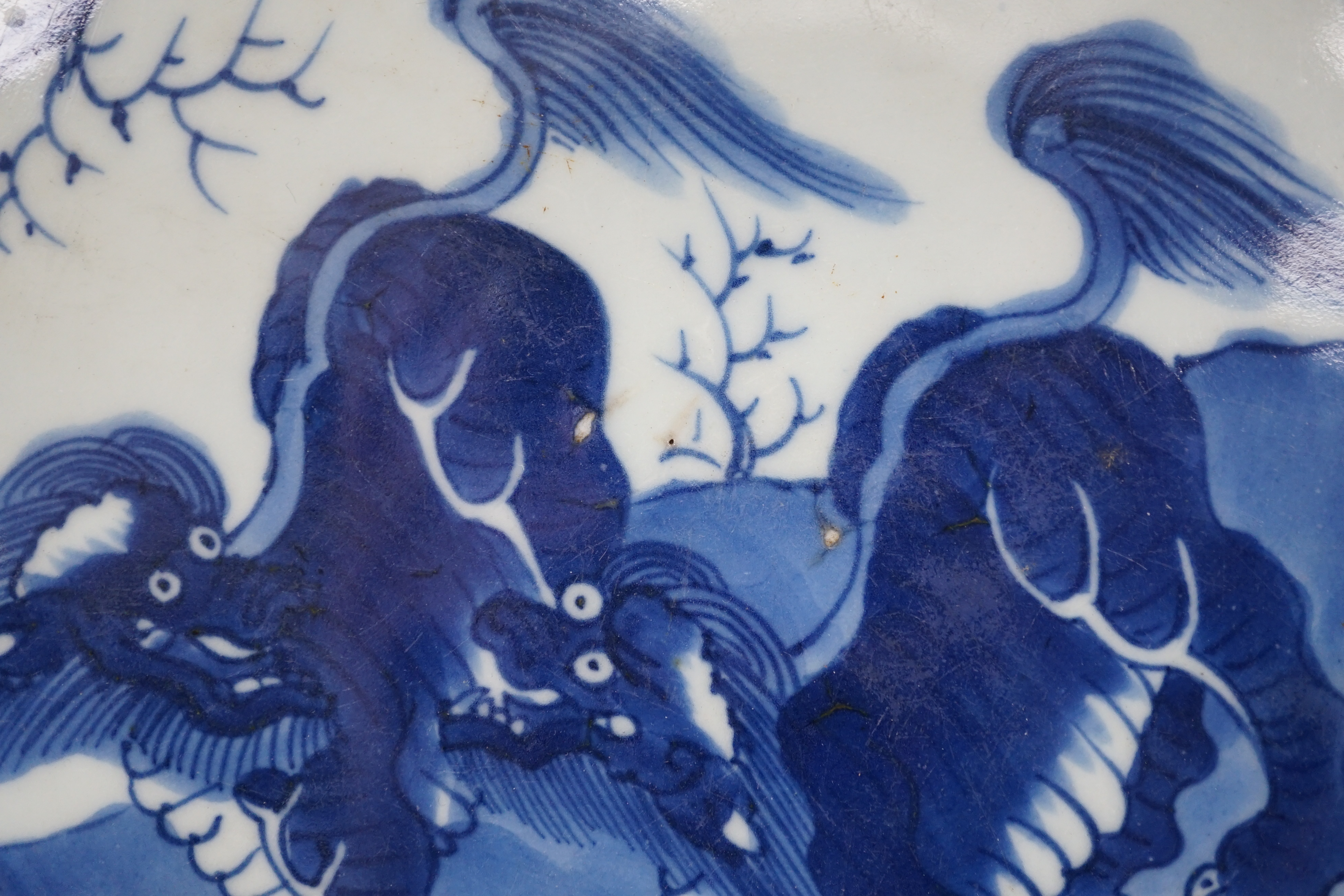 A large Chinese blue and white ‘mythical beasts’ saucer dish, Yongzheng period